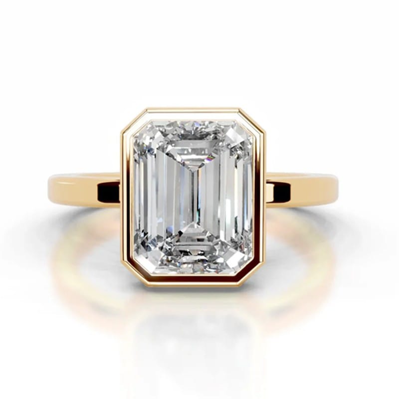 Bezel set emerald cut diamond engagement Ring